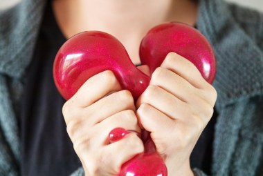 Adult sensory toys - adult squeezing a blubber toy